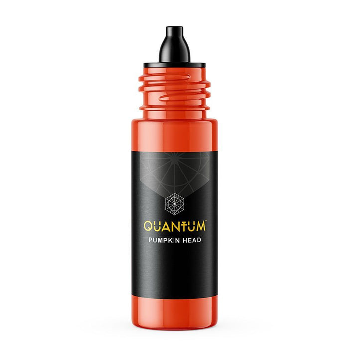 Red bottle with black cap and 'Quantum Pumpkin Head' label on a white background