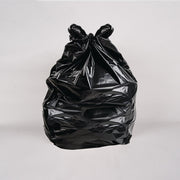 A box of 200 black bin liners, with dimensions 18x29x38 inches, partially opened and displaying the liners inside.