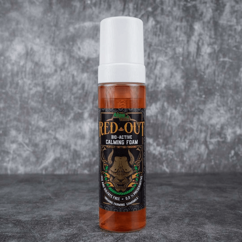 Red Out bio-active calming foam bottle on a gray background