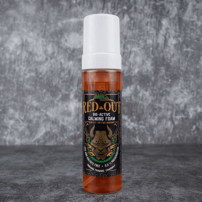 Red Out bio-active calming foam bottle on a gray background