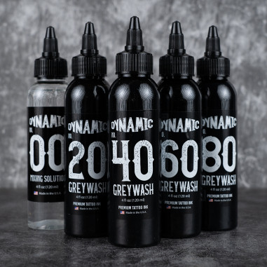 Set of Dynamic Tattoo Ink bottles with various strengths on a dark background