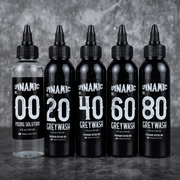 Set of five black bottles labeled with numbers and 'Dynamic' branding on a dark background