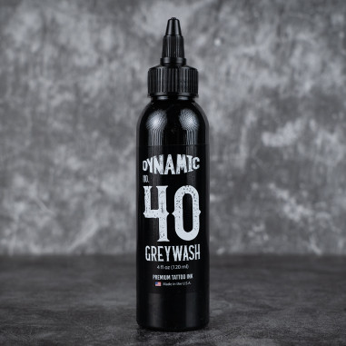 Black bottle of Dynamic Greywash on a dark background