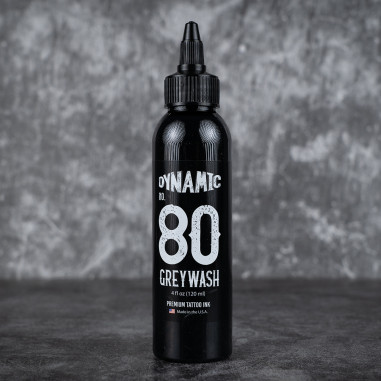 Black bottle of Dynamic No. 80 Grey Wash tattoo ink on a dark background